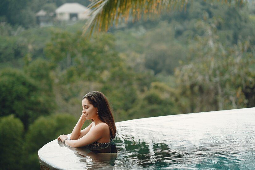 woman swimming pool jungle view 1157 33609 1
