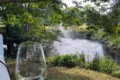 POV: Glass of wine on your private deck overlooking the koi pond water feature. Heaven.