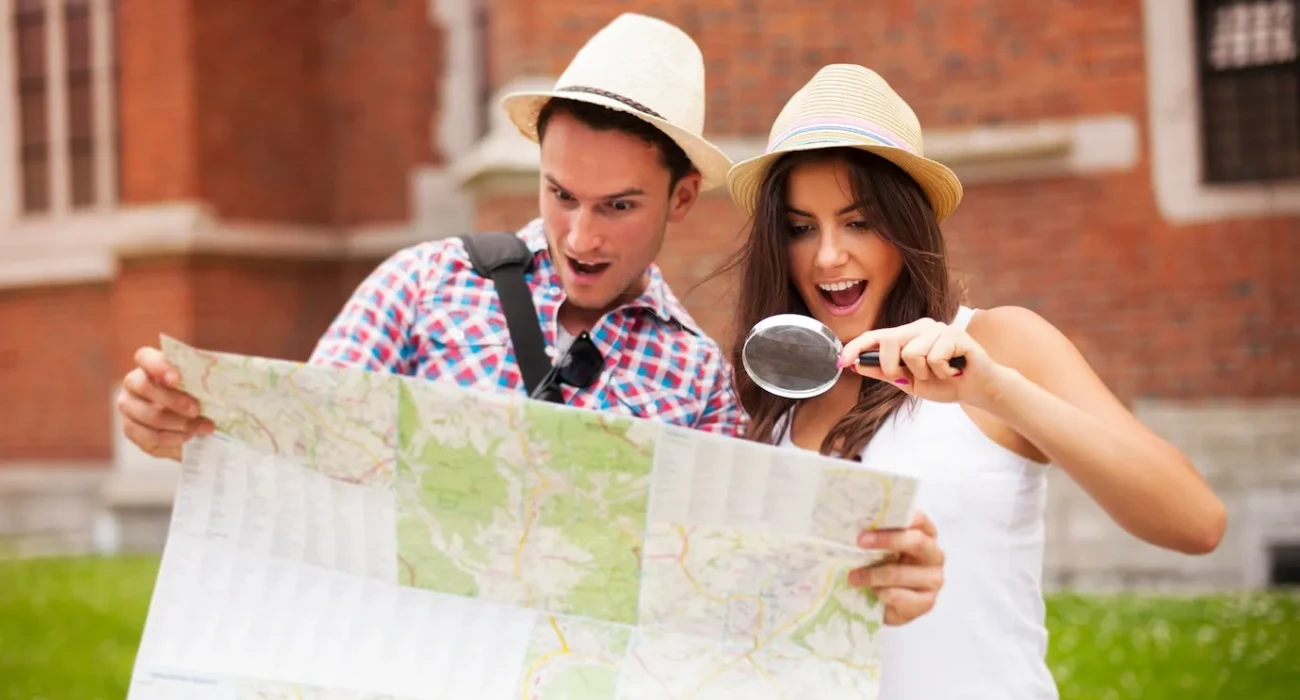 shocked couple looking map throu